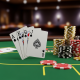 High-angle view of a poker table featuring a winning Royal Flush hand (Ace to Ten of Spades) and a stack of casino chips, symbolizing mastery of poker hand rankings.